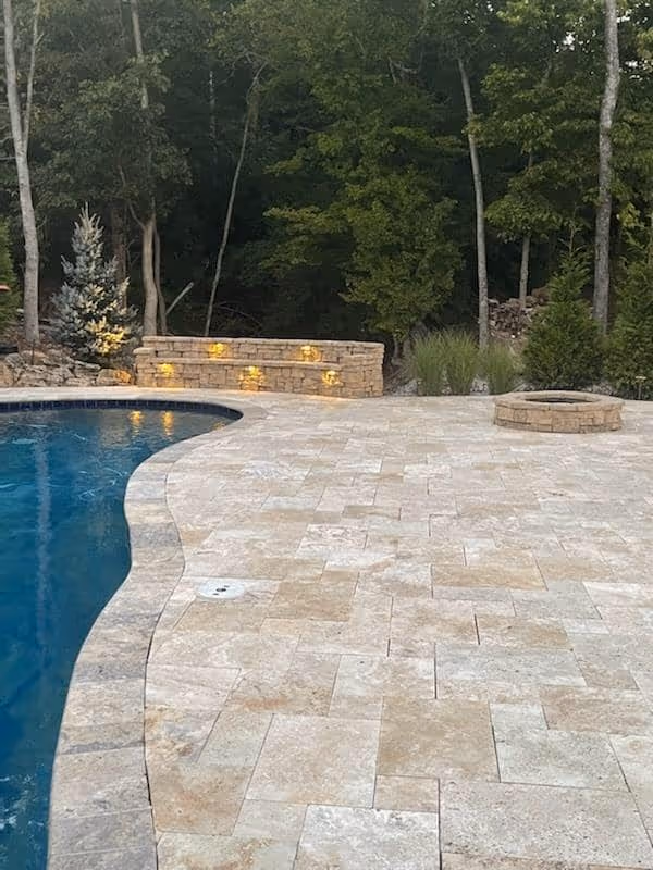 Custom hardscape pool area designed by Lawn Impressions